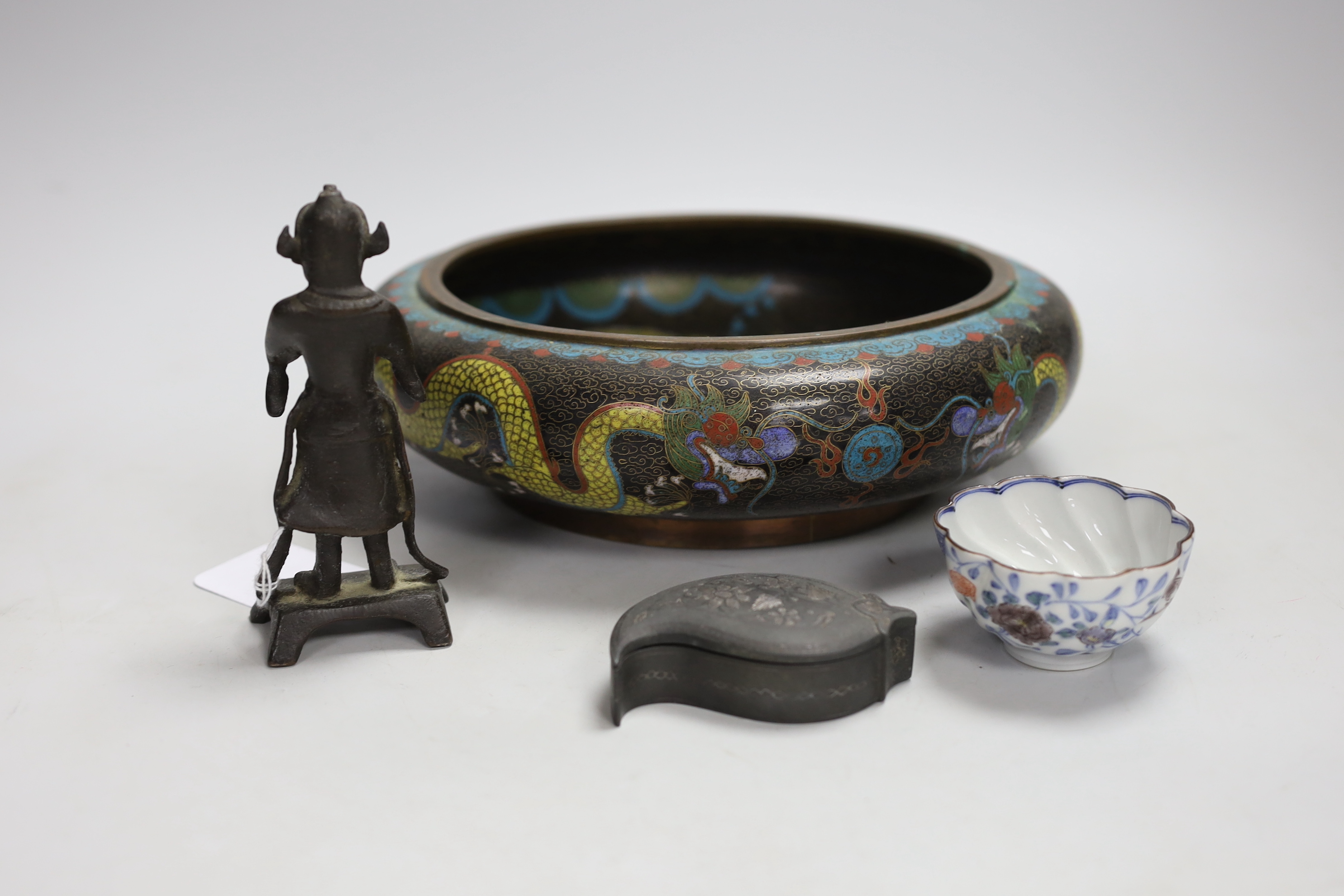 A Chinese cloisonné enamel bowl, a Japanese porcelain tea bowl, an Islamic white metal inlaid pewter box and a bronze figure